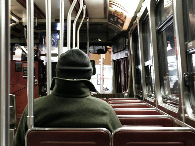 An image of the interior of a nearly empty bus.