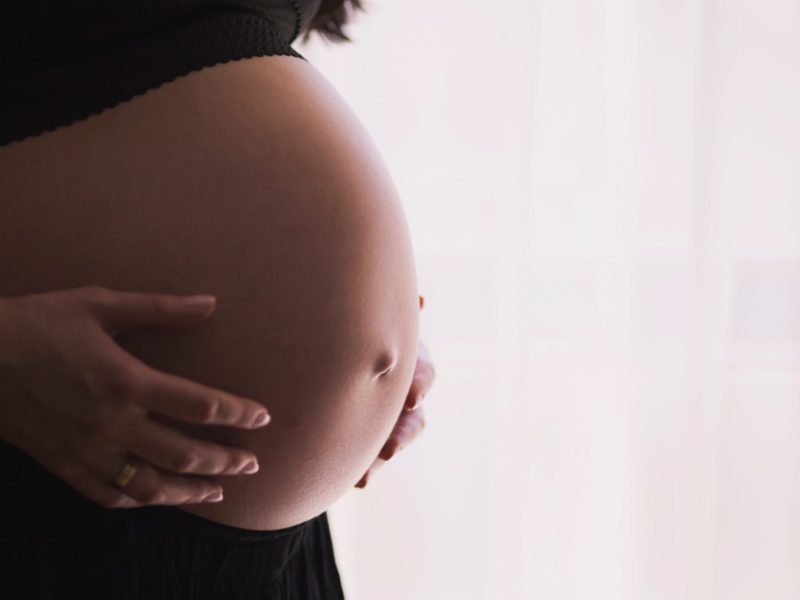 A close-up image of a pregnant belly.