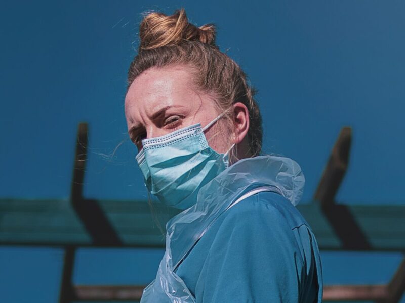 A low angle image of a nurse in personal protective equipment.