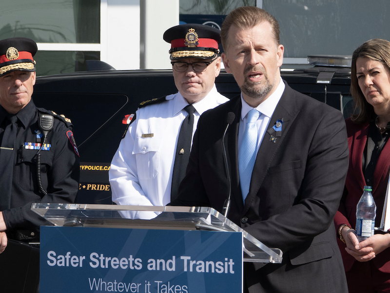 Alberta Public Safety Minister Mike Ellis hyperventilates about street crime at last Tuesday’s Law ’n’ Order press conference in Calgary as Calgary Police Chief Mark Neufeld, Edmonton Police Chief Dale McFee, and Premier Danielle Smith look on.