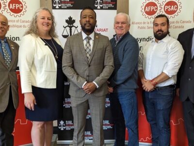 PIctured from left-to-right are: Larry Rousseau, Executive Vice President Canadian Labour Congress, Jennifer Carr, president of the Professional Institute of the Public Service of Canada, Nicholas Marcus Thompson Executive Director of the Black Class Action Secretariat, Chris Aylward National President of the Public Service Alliance of Canada, Alex Silas Regional Executive Vice President of PSAC and Marc Brière National President of the Union of Taxation Employees.