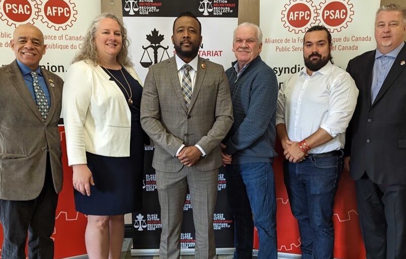 PIctured from left-to-right are: Larry Rousseau, Executive Vice President Canadian Labour Congress, Jennifer Carr, president of the Professional Institute of the Public Service of Canada, Nicholas Marcus Thompson Executive Director of the Black Class Action Secretariat, Chris Aylward National President of the Public Service Alliance of Canada, Alex Silas Regional Executive Vice President of PSAC and Marc Brière National President of the Union of Taxation Employees.