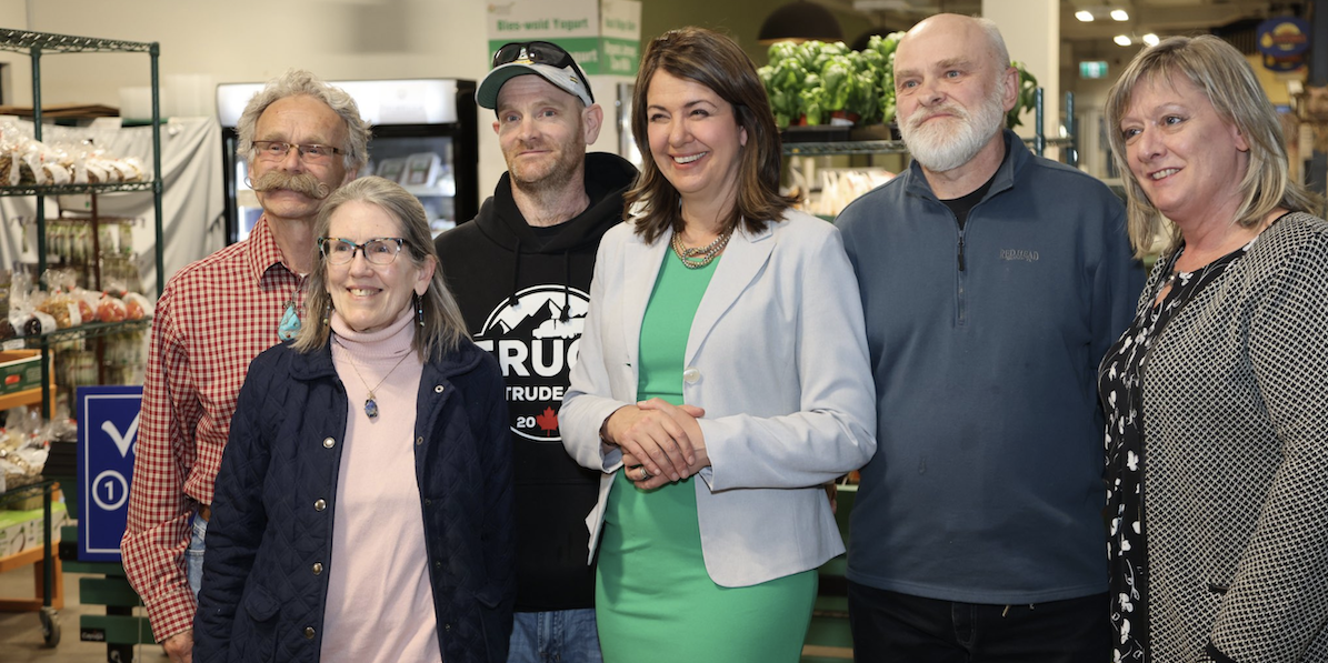 No idea she was associating with convoy supporters? Danielle Smith poses with other participants at last week’s UCP fundraiser, including a gentleman in a “Truck Trudeau” hoodie.