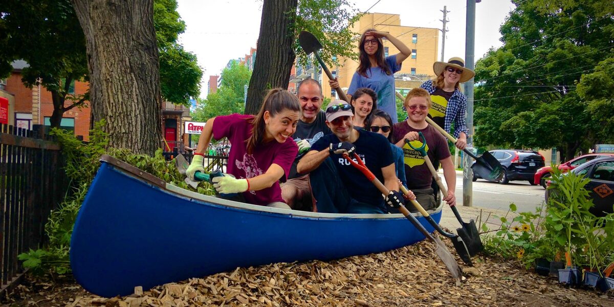 Volunteers in a canoe they will turn into a canoe garden.