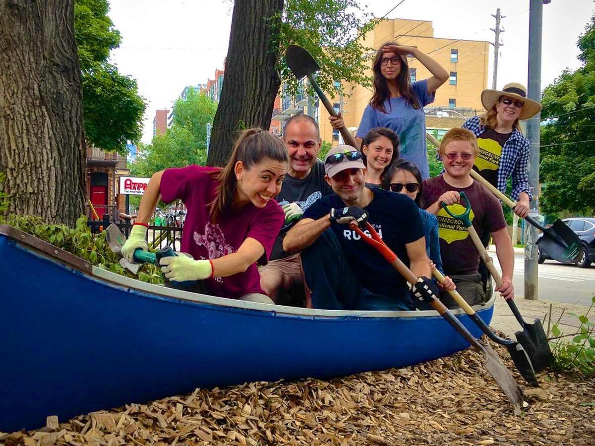 Volunteers in a canoe they will turn into a canoe garden.