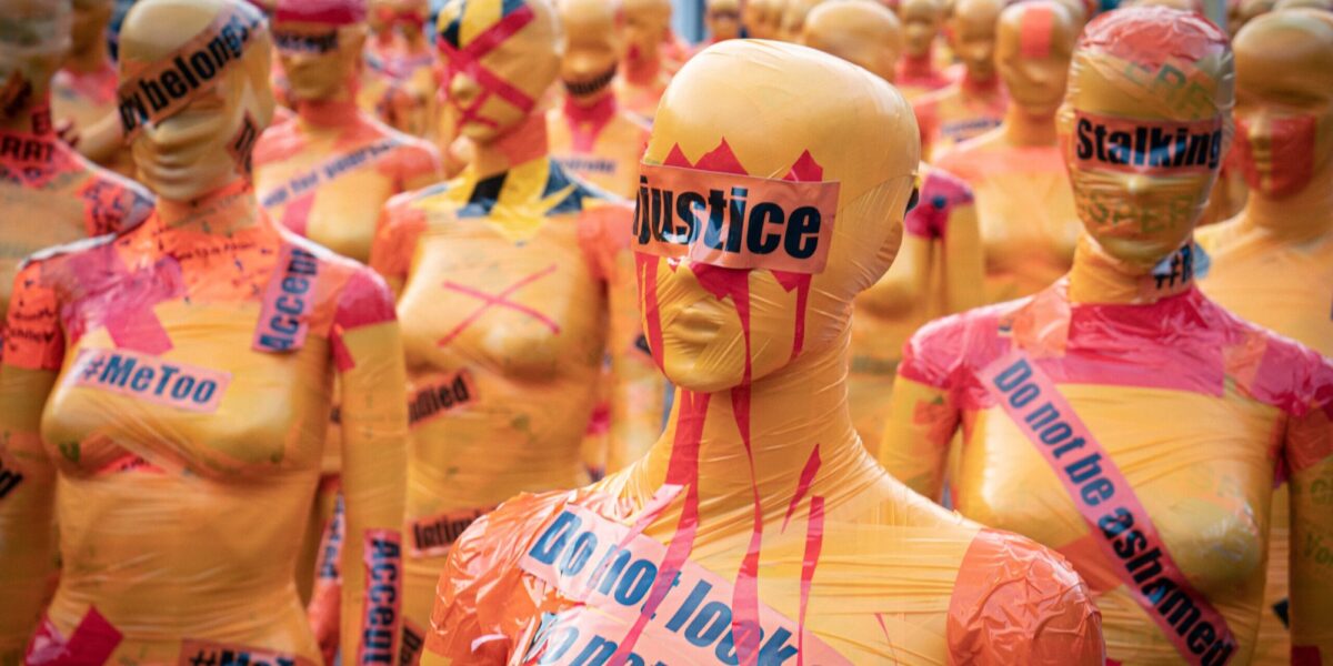 Mannequin with the word 'justice' covering its eyes