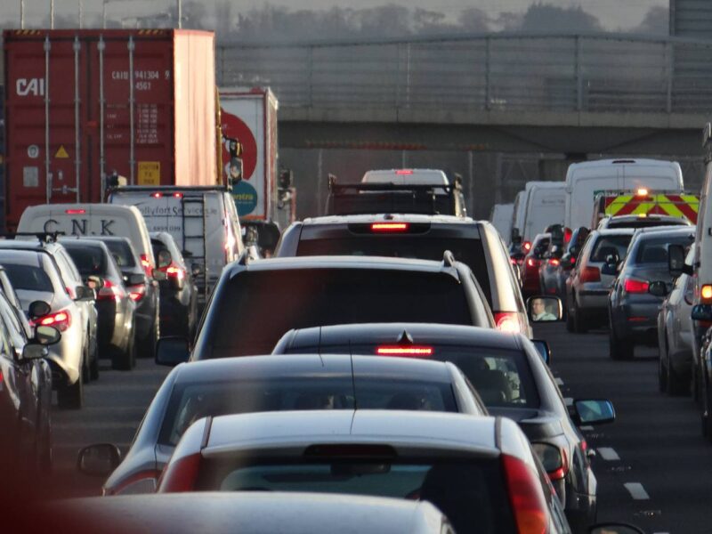 Cars idling in traffic.