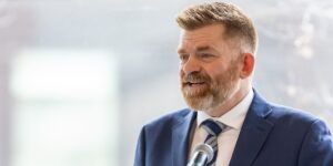 Former MP and Wildrose Leader Brian Jean speaking at a microphone.