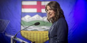 Alberta Premier Danielle Smith behind a podium on election night.