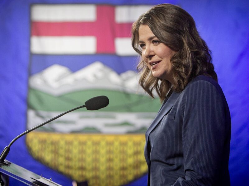 Alberta Premier Danielle Smith behind a podium on election night.