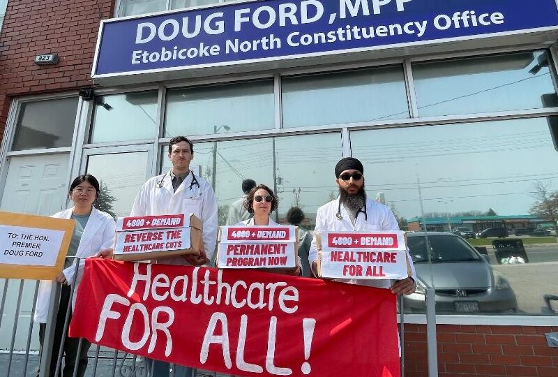 Members of Health for All Now protest the privatization of health care in front of Ontario Premier Doug Ford's office.