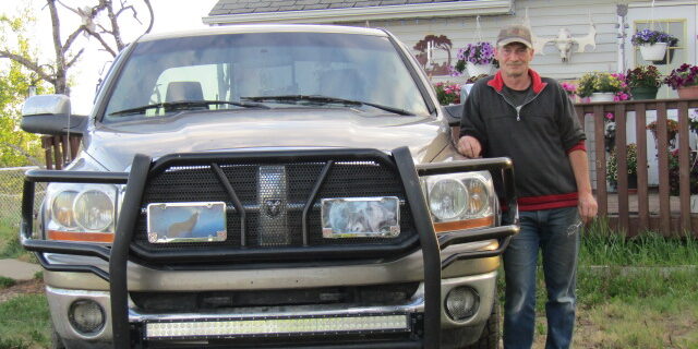 Ronald Vehse standing next to his truck.