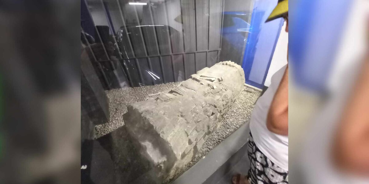 A Jewish coffin displayed behind plexiglass in a parking structure in Seville, Spain.