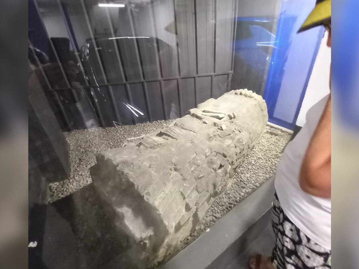 A Jewish coffin displayed behind plexiglass in a parking structure in Seville, Spain.