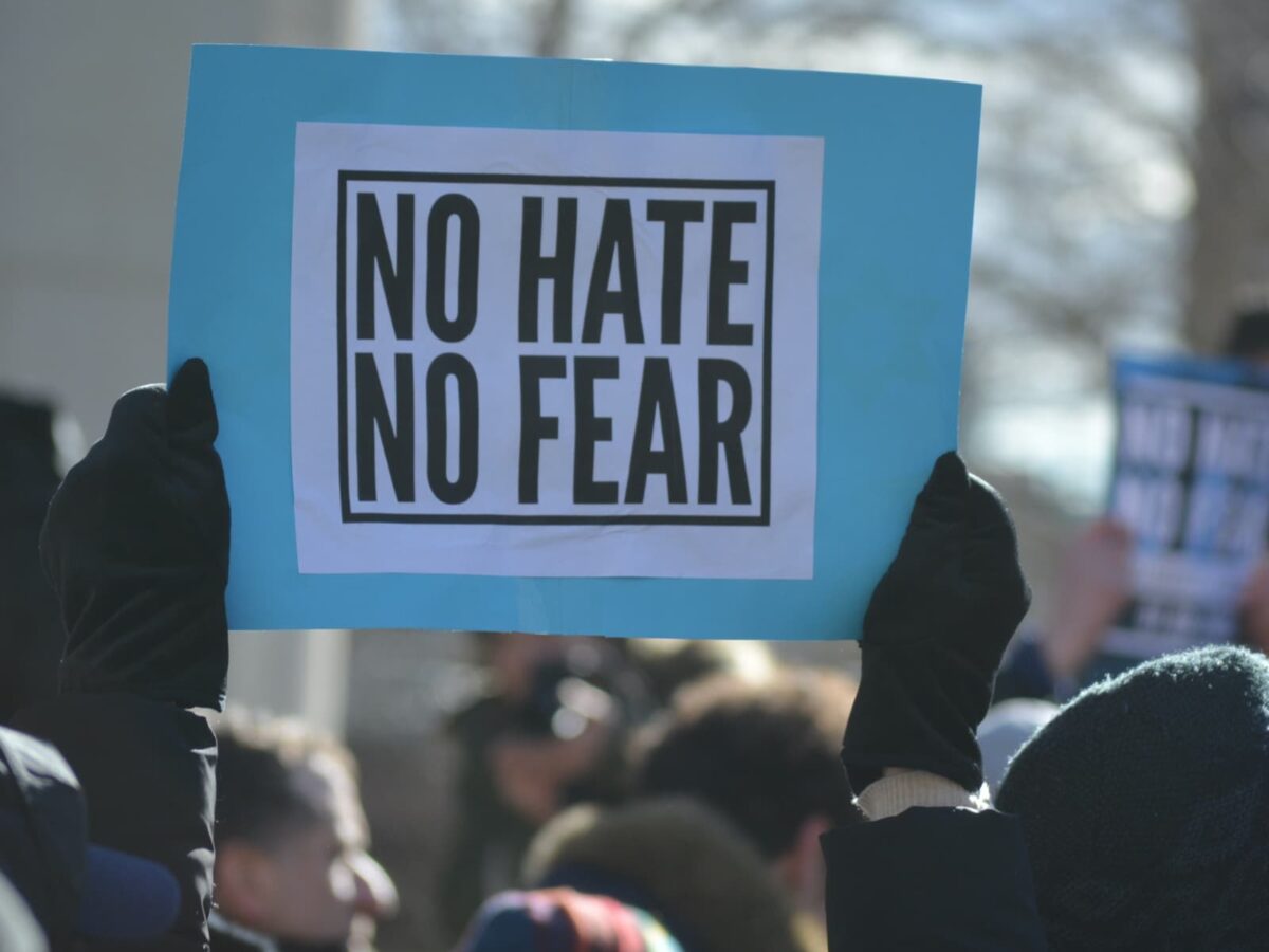 A sign reading "No Hate, No Fear" from the CIJA website.