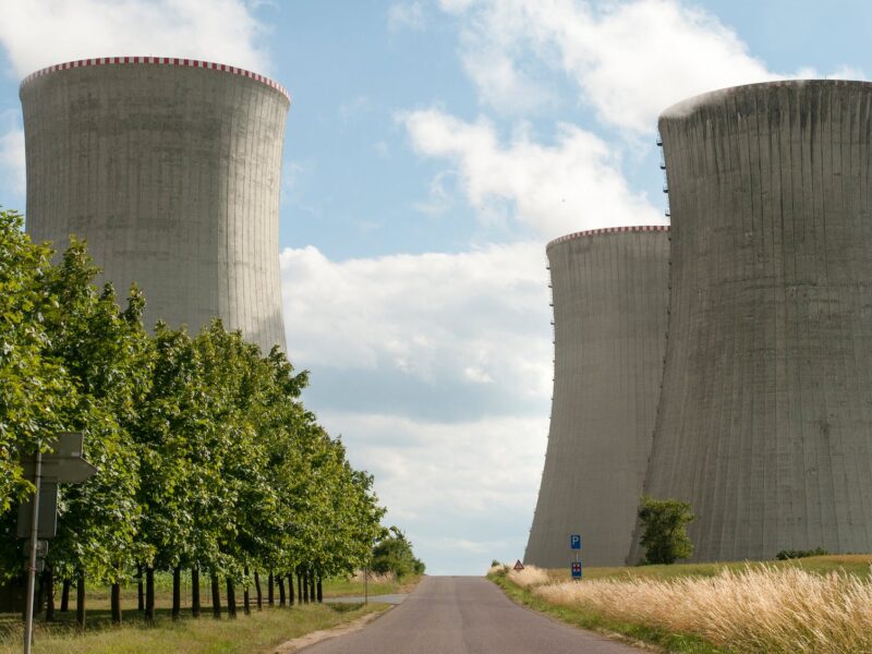 A gray road leads to a nuclear power plant