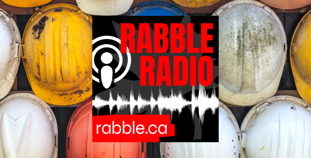 rabble radio logo and a row of multicoloured hardhats in background