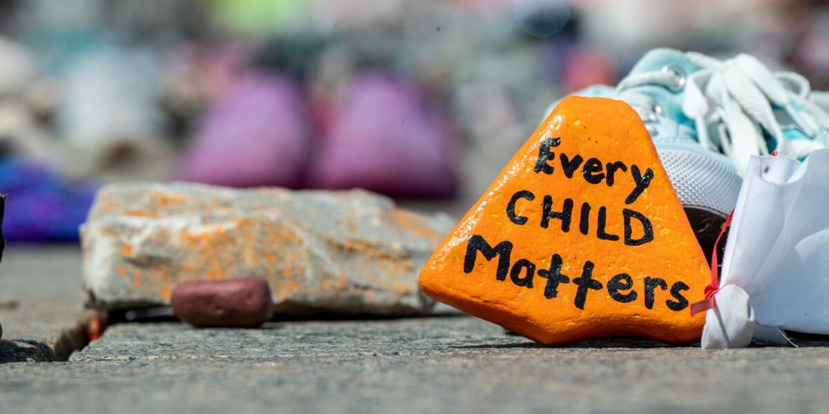 An orange stone reading Every Child Matters.