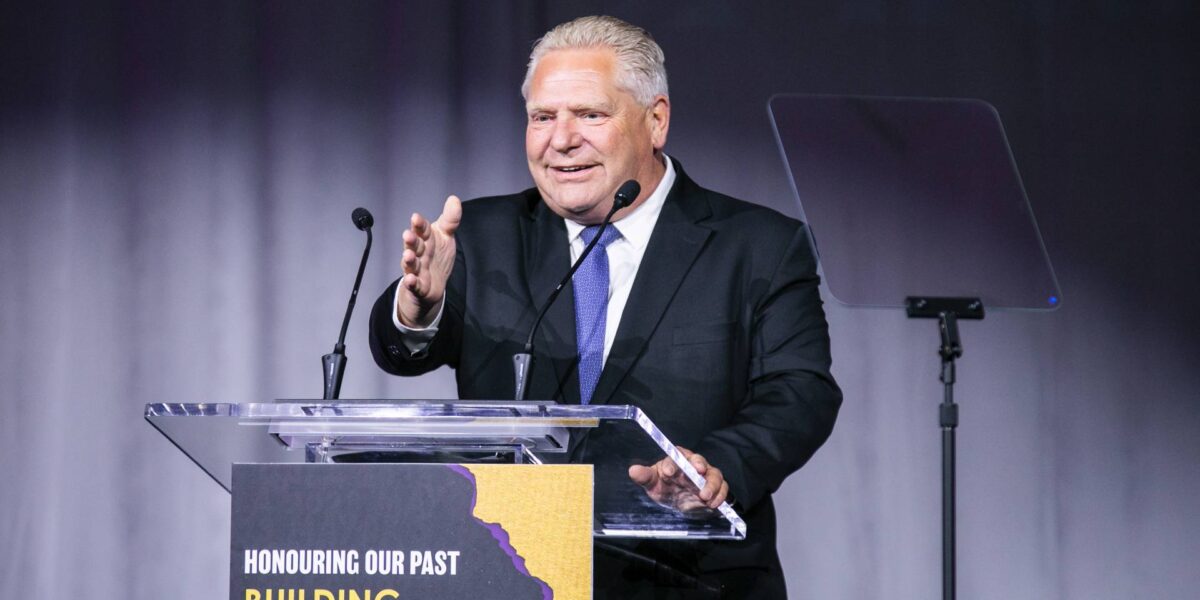 Doug Ford speaking behind a podium at the Vaughn Mayor's gala on June 7, 2023.