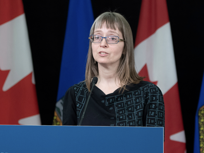 Then-chief medical officer of health Deena Hinshaw wearing her signature periodic table of the elements dress during a COVID-19 news conference in April 2020.