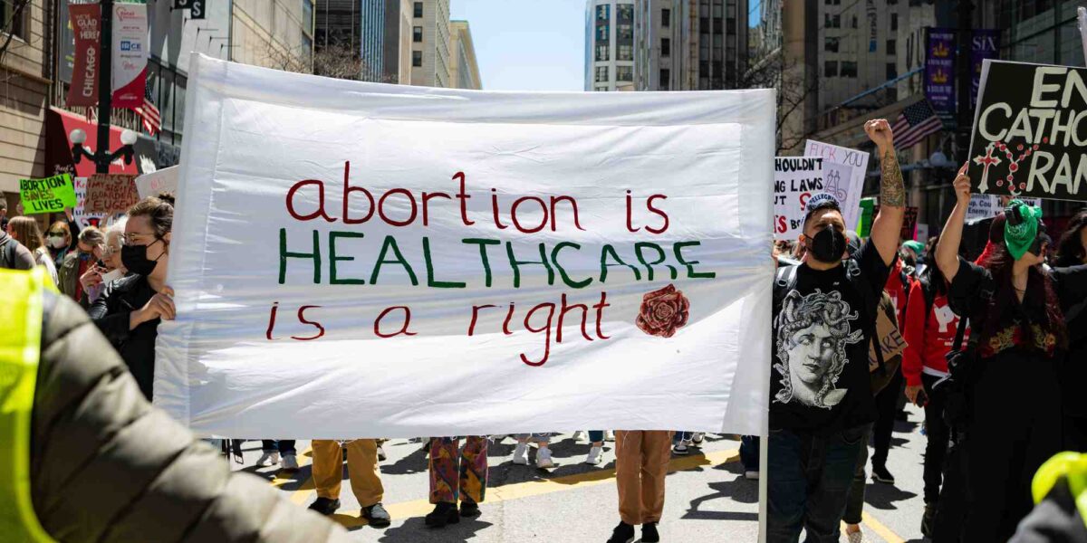 A pro-choice sign reads abortion is healthcare, abortion is a right.