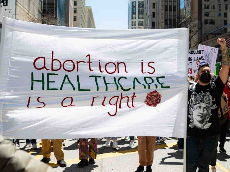 A pro-choice sign reads abortion is healthcare, abortion is a right.