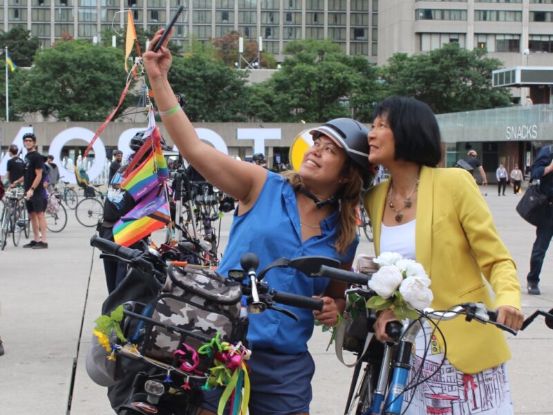 Olivia Chow taking a selfie with a fellow cyclist.