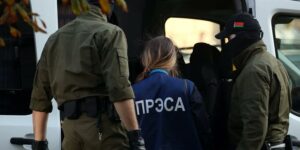 Belarusian state security detain journalist during 2020 political rally.