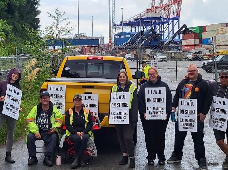 Members of the International Longshore and Warehouse Union Canada on their legal picket line Sunday at the Port of Vancouver.