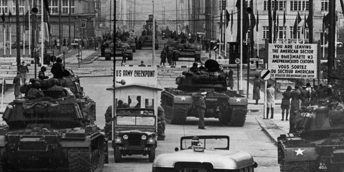 U.S. Army tanks face off against Soviet tanks at Checkpoint Charlie, Berlin, October 1961, during the Cold War.