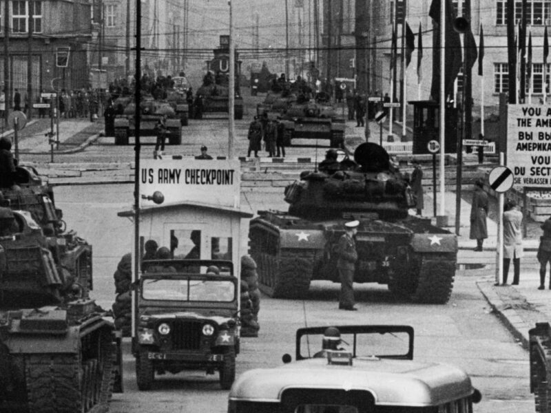 U.S. Army tanks face off against Soviet tanks at Checkpoint Charlie, Berlin, October 1961, during the Cold War.