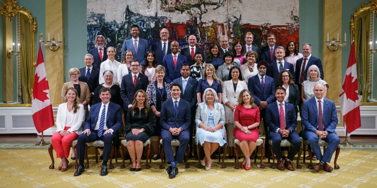 Prime Minister Justin Trudeau's new cabinet sits for its first group photo on July 26, 2023.