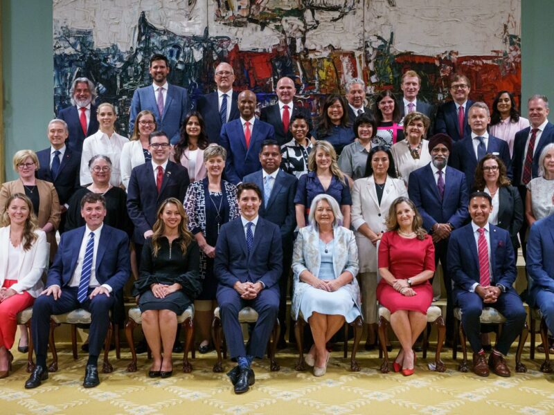 Prime Minister Justin Trudeau's new cabinet sits for its first group photo on July 26, 2023.