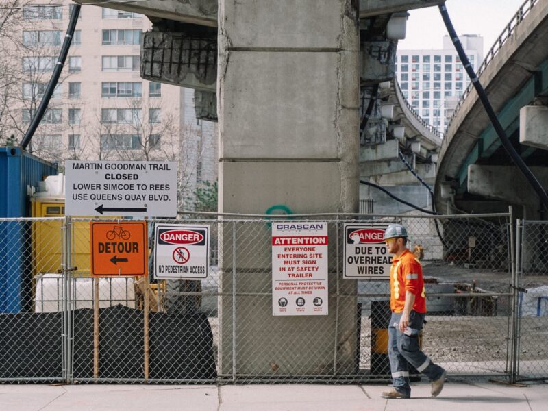 Construction and road closure signs under Toronto's Gardiner Expressway.