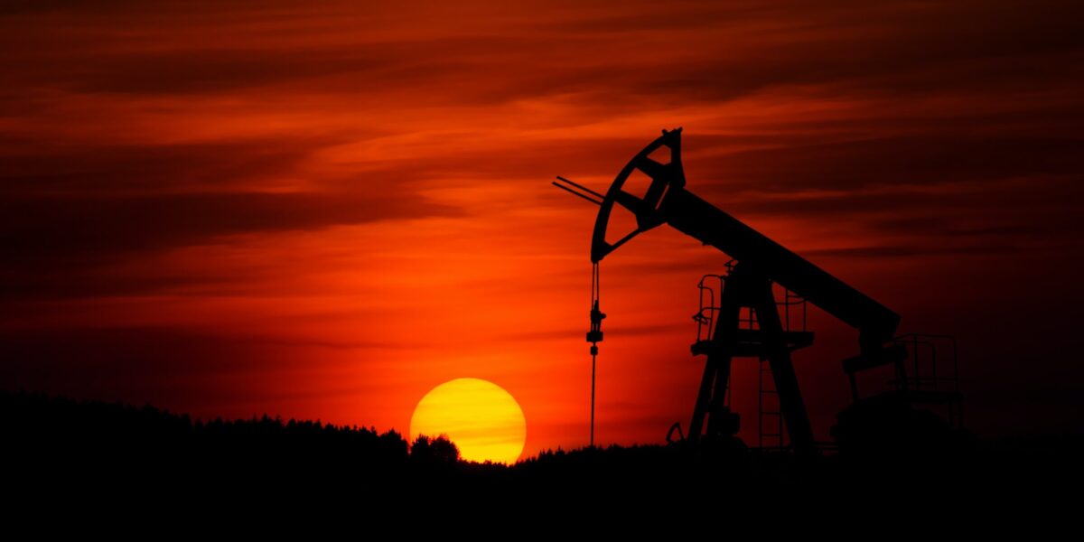 oil drill with sunset in background