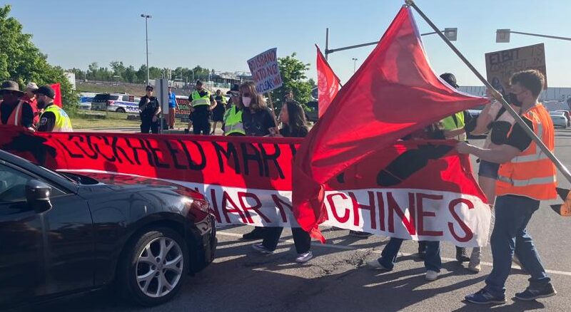 Protesters at CANSEC 2023.