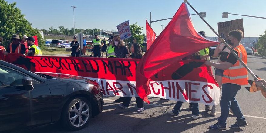 Protesters at CANSEC 2023.