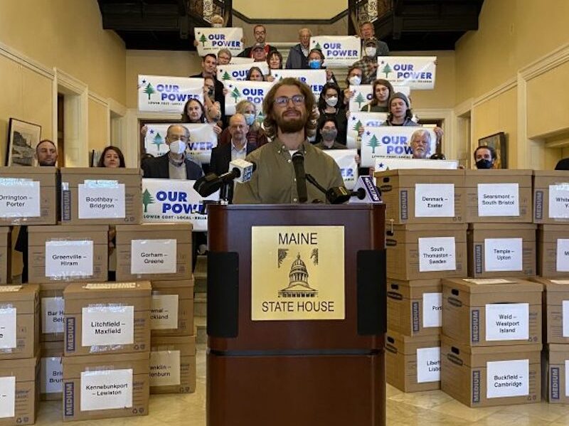 Supporters of Pine Tree Power deliver boxes of petitions with more than 80,000 signatures last fall to the Maine State Capitol in Augusta.