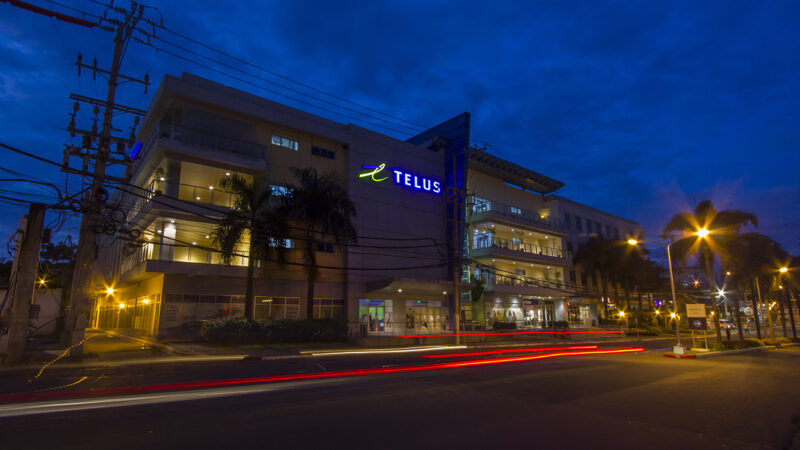 An image of a Telus building in the Philippines. Telus's friendly brand obscures their unfriendly labour practices.