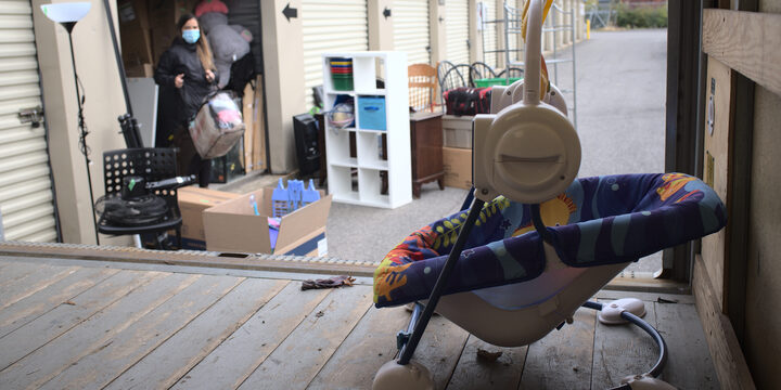 A shelter movers volunteer helping move a clients possessions.