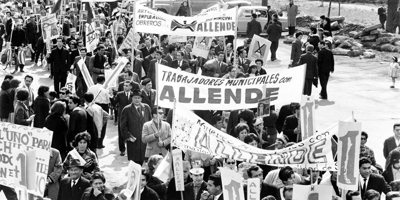 A crowd of people marching to support the election of Salvador Allende for president in Santiago, Chile in 1964.