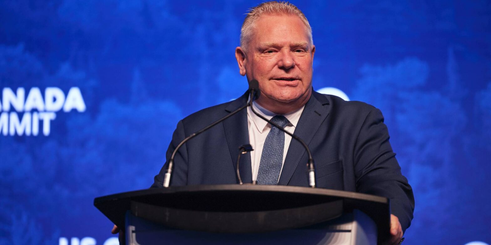 Ontario Premier Doug Ford speaking at a podium.