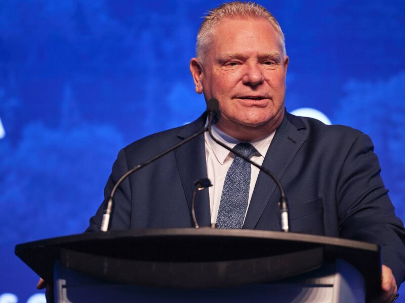 Ontario Premier Doug Ford speaking at a podium.
