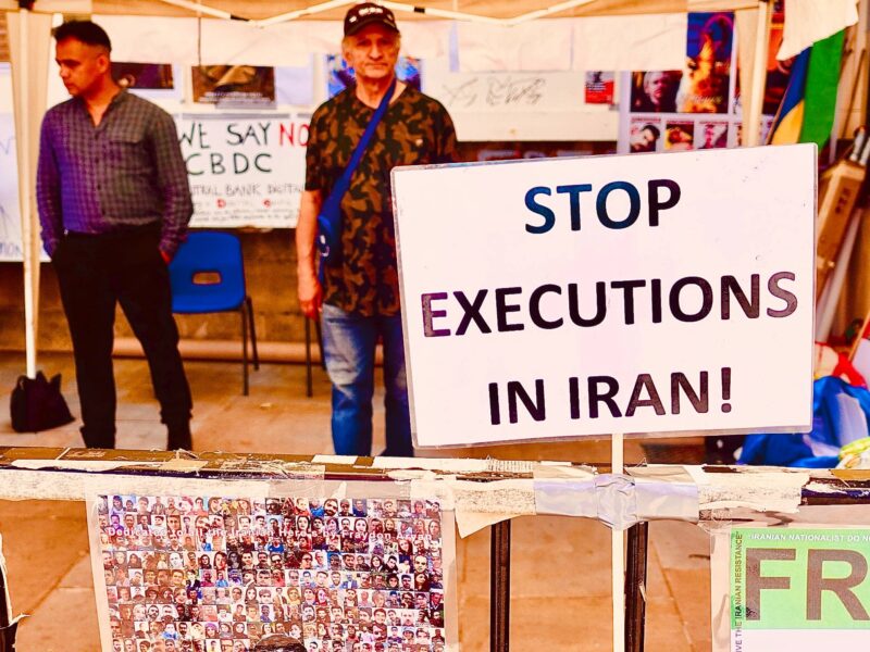 A protest sign calling for an end to executions in Iran.