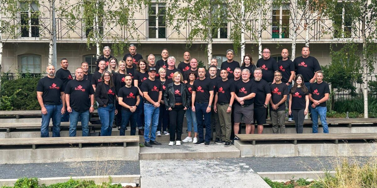 Unifor President Lana Payne stands in the centre alongside the union’s automotive bargaining team.