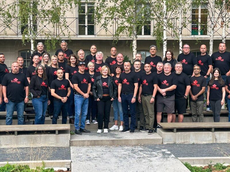 Unifor President Lana Payne stands in the centre alongside the union’s automotive bargaining team.