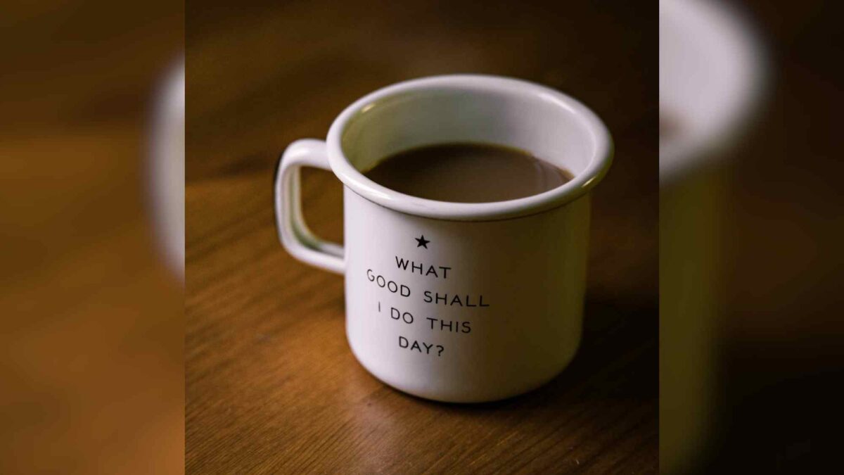 A coffee cup with the words "What Good Shall I Do Today" written on it.