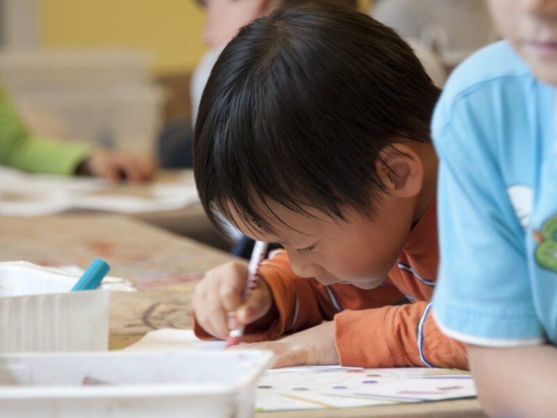 An image of an elementary school student doing work. The learning conditions of these students relies heavily on a fair contract for teachers, who will be filing for conciliation.