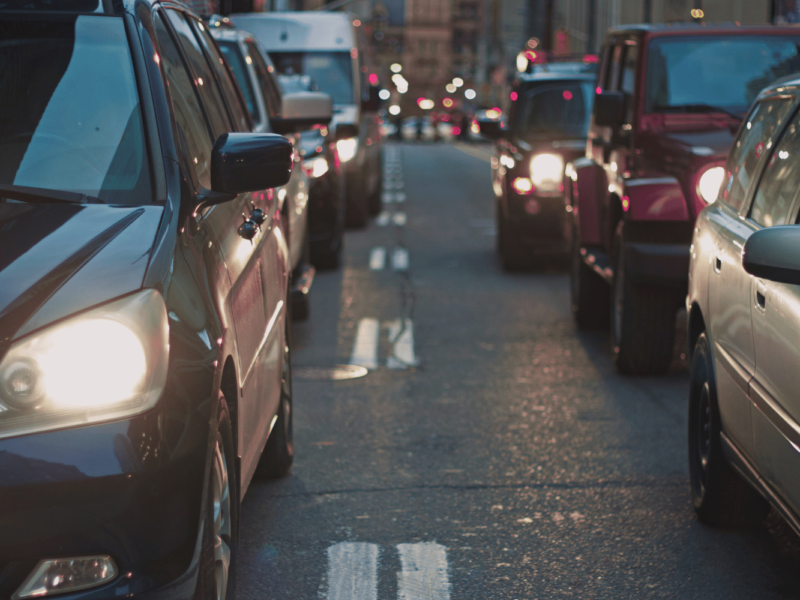 An image of cars moving through traffic