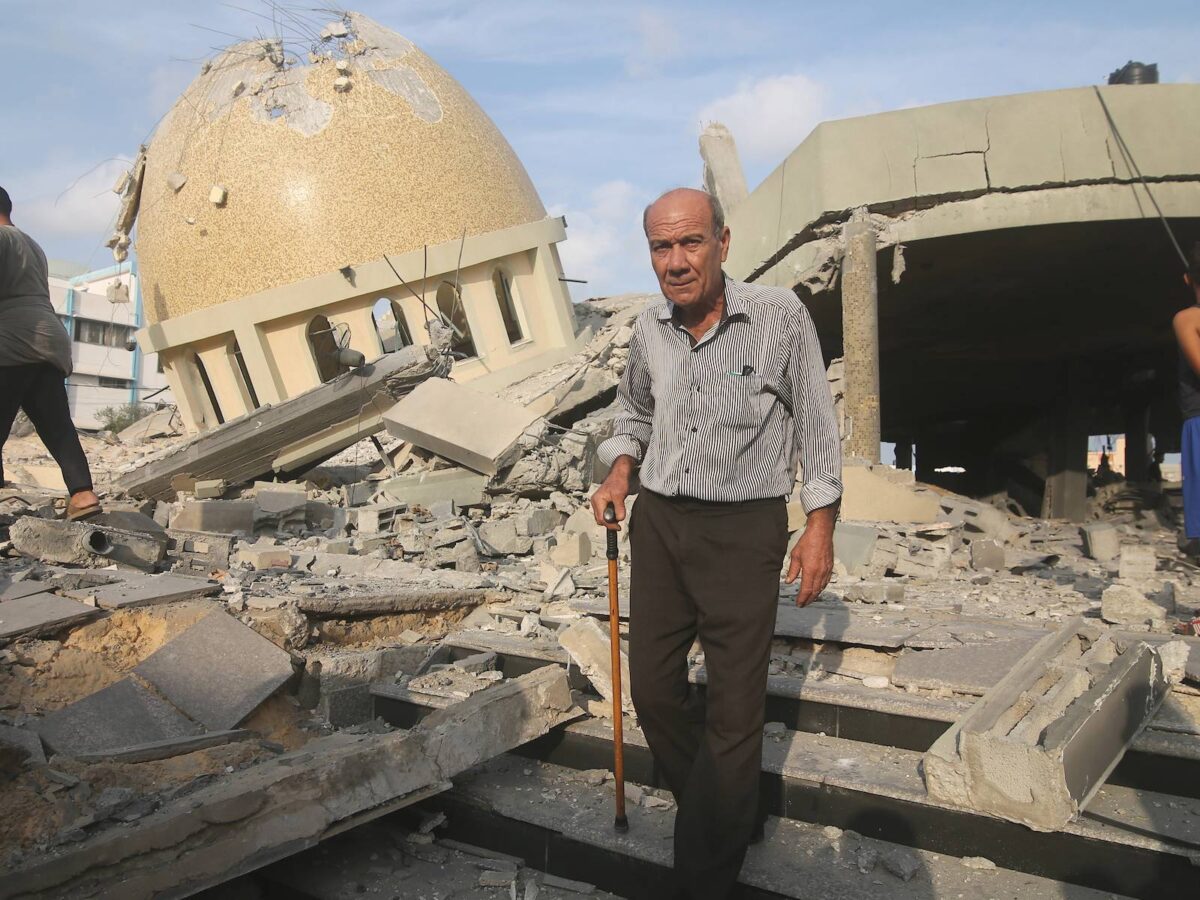 Palestinians inspect the ruins of a building destroyed in Israeli airstrikes in Khan Younis in the southern of Gaza strip, on October 8, 2023.